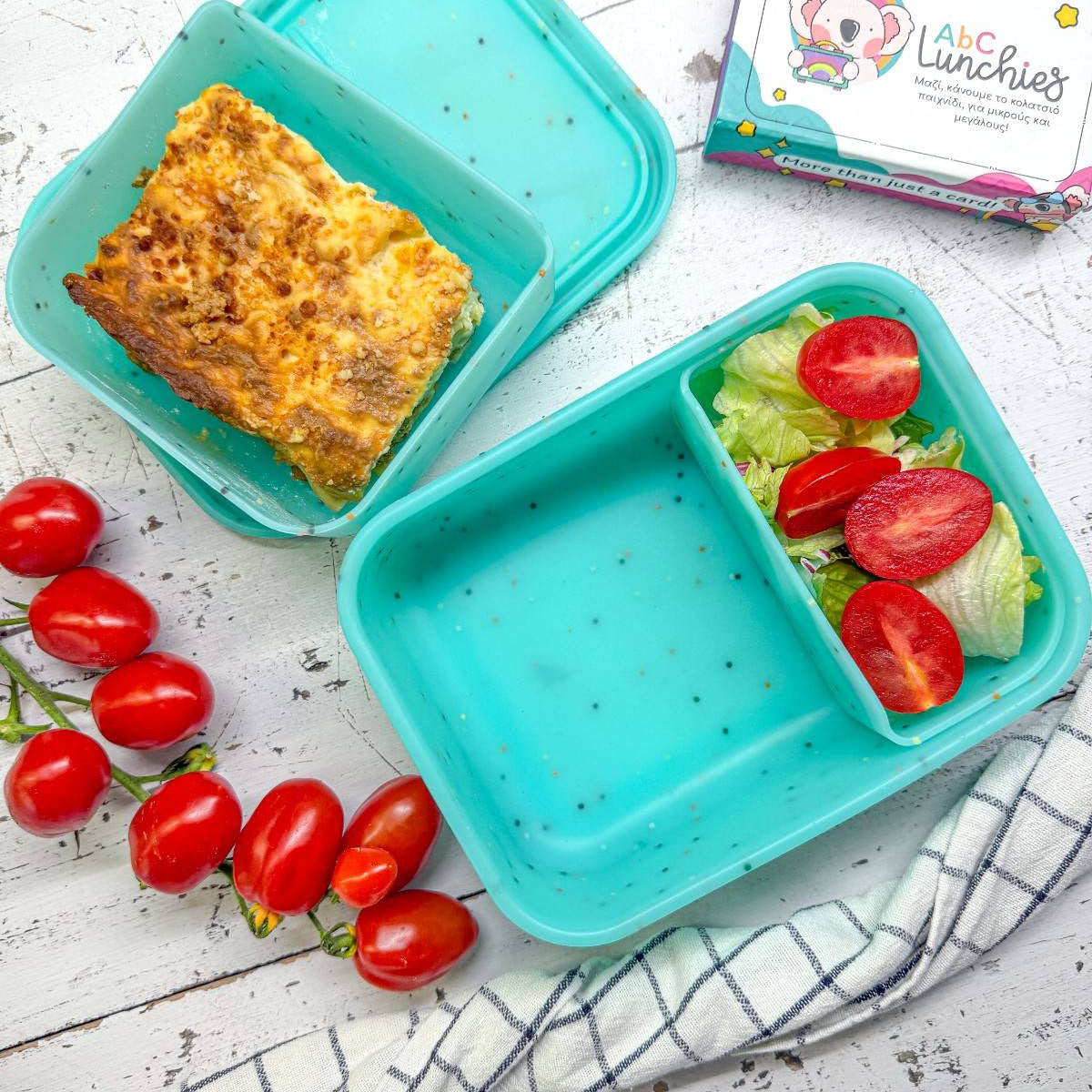 Niebieski dwudzielny pojemnik śniadaniowy z elastycznego silikonu ABC Lunchies Aqua Pop