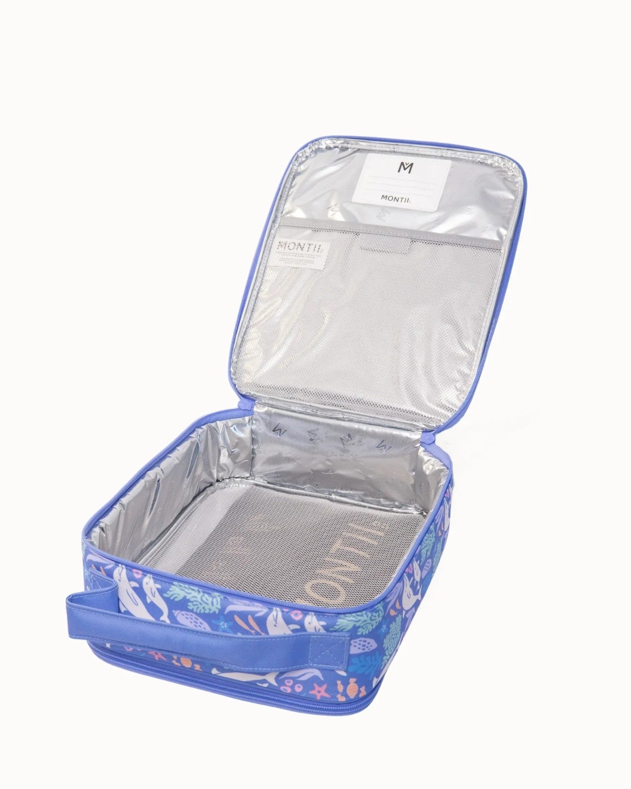 Duża torba na lunch MontiiCo mieszcząca lunchbox i bidon w niebieskim kolorze z delfinami