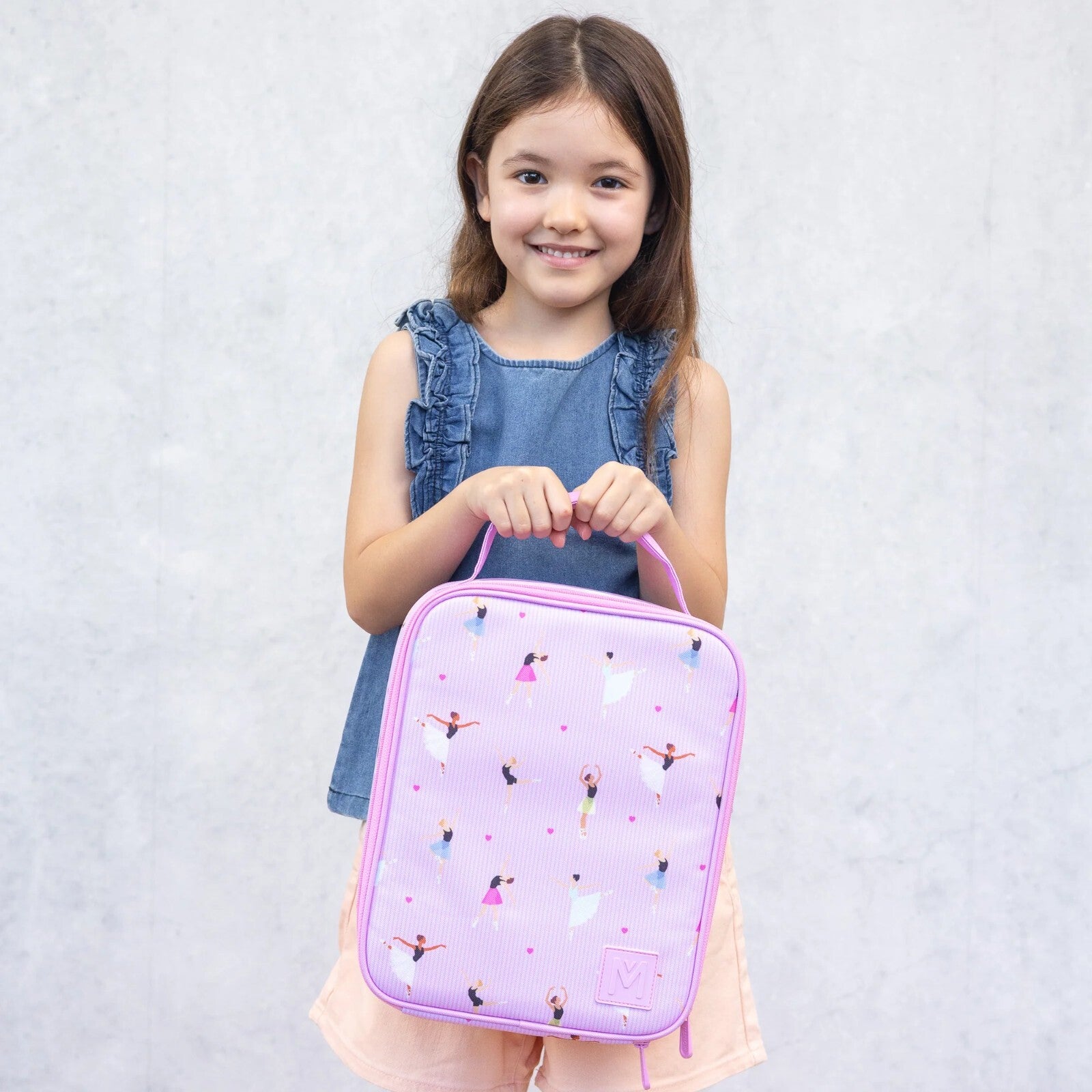 Pojemna, różowa torba na lunch MontiiCo Twirl, mieści dużą śniadaniówkę i bidon