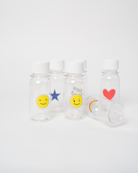 Mini buteleczki Yumbox – kompaktowe, szczelne, do napojów, idealne dla dzieci do szkoły, wzór: tęcza/buźka