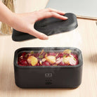 Monbento Warmer – elektryczny lunchbox 700 ml z 3 trybami podgrzewania. Ciepły posiłek w 15–30 min, szczelny, kompaktowy, made in France.