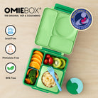 OmieBox Apple Green – pastelowo zielony lunchbox z termosem, przegródkami i uchwytem, idealny do szkoły i przedszkola.