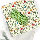 Woskowijka do kanapek BeePack® L – ekologiczne, wielorazowe opakowanie na żywność z naturalnych materiałów, zero plastiku, wzór: łąka